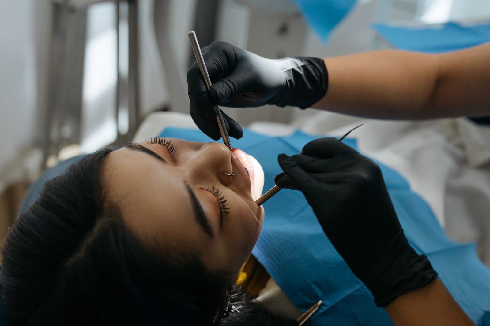 Dentist examining patient with suspected emergency tooth abscess